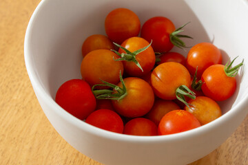 A view of a bowl of cherry tomatoes.