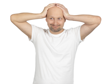 Playful bald man smiling while holding his head