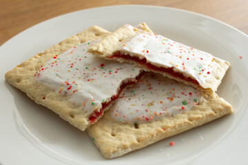 A view of some popular strawberry toaster strudels on a plate.