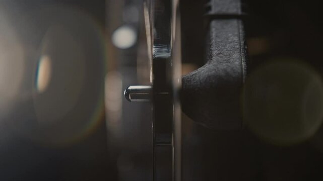 Close ups of a vintage 8MM projector spools moving and playing film 