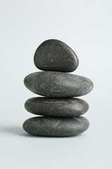 Stack of rocks on light background. Harmony and life balance