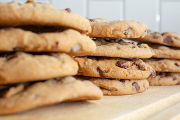 A closeup view of stacks of chocolate chip cookies.