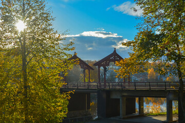 View of the Gamle Bybro Old Town Bridge with Lykkens portal (Gate of Happiness) over the Nidelva River in autumn in Trondheim, Trondelag County, Norway