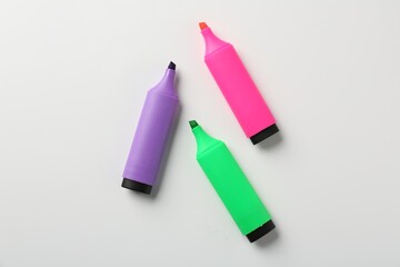 Bright highlighters on white background, flat lay