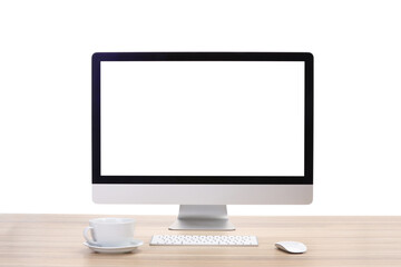Computer monitor, keyboard, mouse and cup of drink on wooden desk against white background