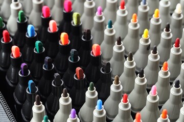 Many colorful markers in bag, closeup. Art supplies © New Africa