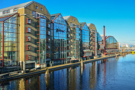 Trondheim, Norway &ndash; October 18, 2024 - Wooden and glass exterior view of the Radisson Blu Royal Garden Hotel on Nidelva River in Trondheim