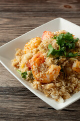 A view of a plate of shrimp fried rice.