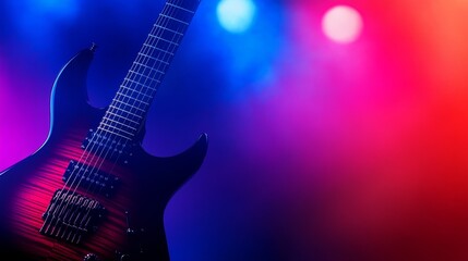 Fototapeta premium Electric guitar illuminated by colorful stage light, creating a vibrant atmosphere for a concert