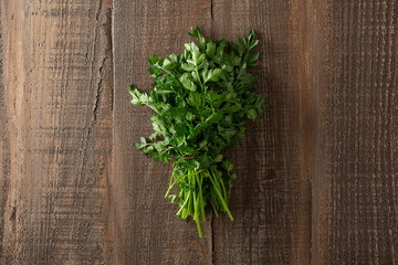 A top down view of a bundle of flat leaf parsley. © DAVID