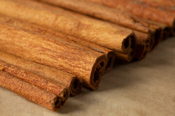 A closeup view of a pile of cinnamon sticks.