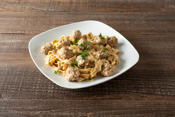A view of a plate of Swedish meatballs.