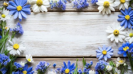 Obraz premium Spring flowers frame on wood; blank space for text; nature background; greeting card