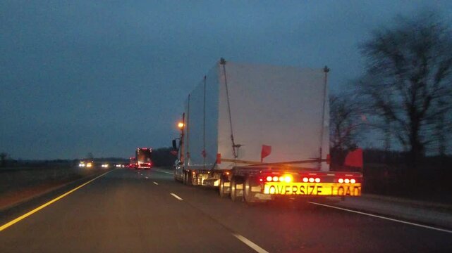 Driving Behind a Transport Truck With Oversized Load on Highway