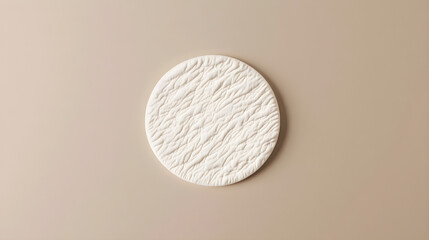 Plain monochromatic circular patch mockup placed on a flat neutral background for versatile...