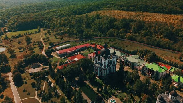 Curchi Monastery. Enjoy a stunning aerial view showcasing an expansive estate nestled peacefully in a vibrant and lush forest landscape
