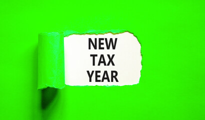 New tax year symbol. Concept words New tax year on beautiful white paper. Beautiful green table green background. Business new tax year concept. Copy space.