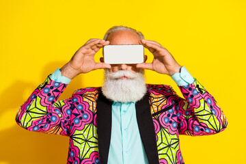 Photo of attractive retired man cover eyes gamer headset dressed stylish colorful pink fancy clothes isolated on yellow color background