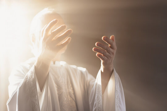 Priest raising his hands at the 'Our Father'. Catholic Liturgy. Celebrating Holy Communion. Eucharistic Prayer. Homily. Prayers of the Faithful. Final Blessing