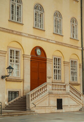 Fototapeta premium yellow building with door and clock