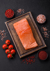 Fresh raw salmon steak with spices and herbs