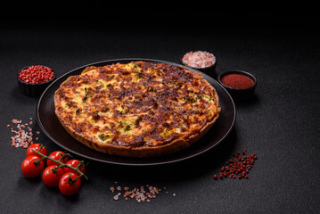 Delicious fresh quiche with broccoli, cheese, spices and herbs