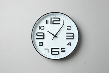 Big beautiful stylish clock on gray background