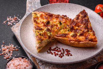 Delicious fresh quiche with broccoli, cheese, spices and herbs