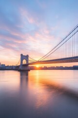 Obraz premium vibrant image of cruise ship passing under famous bridge at sunset with golden reflections on water