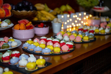 Colorful and delicate pastry assortment showcases the artistry of dessert creation at a gourmet event in the evening
