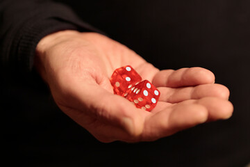 Hand holding, rolling two dices, take a chance to lucky opportunity concept.