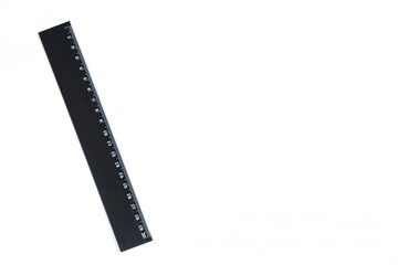 One black ruler on white table, top view. Space for text