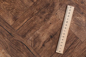 One ruler on wooden table, top view. Space for text
