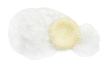 Soap with foam on white background, top view