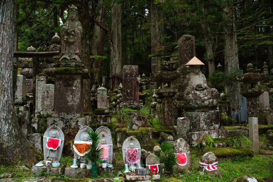 Stone statues of Jizō Bodhisattva, a common type of Japanese religious figure often found in temples and cemeteries. Okunoin Temple, Koyasan, Wakayama Prefecture, Japan.