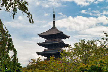Naturally framed photograph of Tō-ji, which is a shingon Buddhist temple in the city of Kyoto, Japan.

