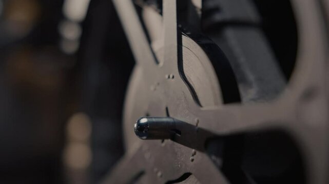 Close ups of a vintage 8MM projector spools moving and playing film 