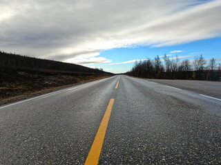 Endless Journey: Open Road under a Sweeping Sky