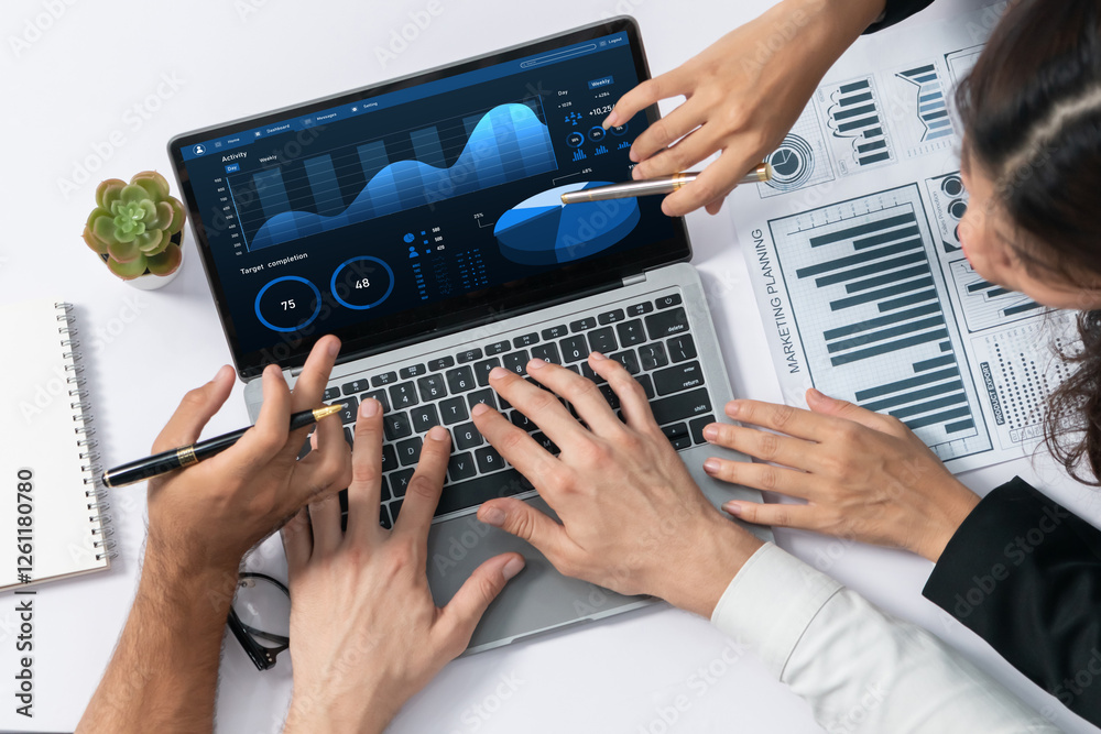 Fototapete top view workspace of analyst team uses bi fintech display laptop to analyze financial data . busine