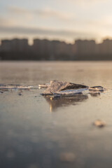 Frozen surface of a reservoir in winter. Ice.