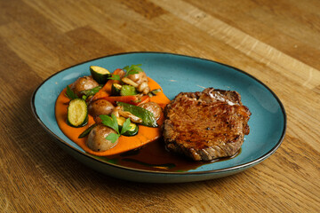 Grilled steak with roasted vegetables and mashed potatoes