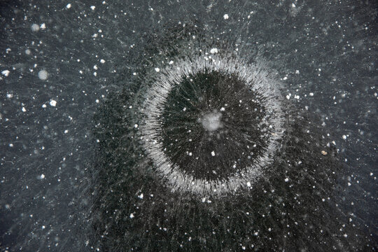 Frozen surface of a reservoir in winter. Ice.