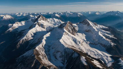 Fototapeta premium Breathtaking Aerial View of Snow-Capped Mountain Peaks