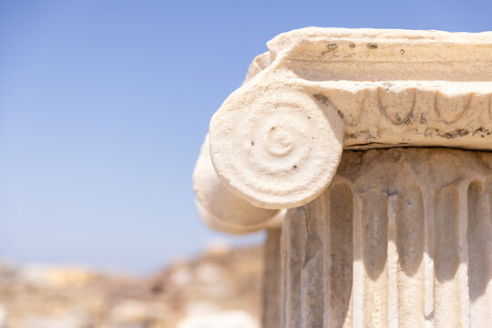 Ancient Greek architecture and ruins on Delos, Greece on a sunny day.