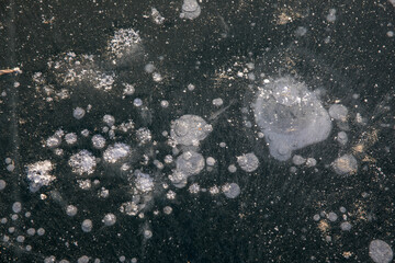 Frozen surface of a reservoir in winter. Ice.