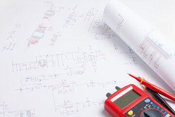 Electronic circuit schematic with multimeter on white background
