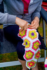 middle-aged woman knitting crochet