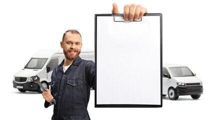 Mechanic with vans showing a blank document with a clipboard