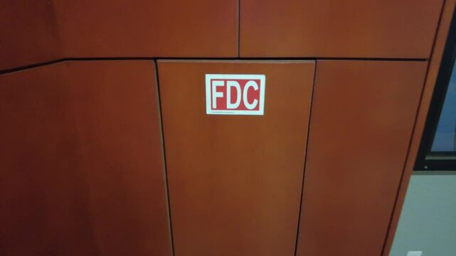 FDC Sticker Displayed on a Wall Near Urban Setting