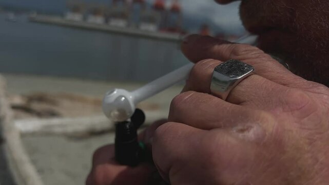 smokes marijuana Boy lights crack rocks in glass pipe. snorts powdered cocaine. Boy snorts cocaine in movie theatre